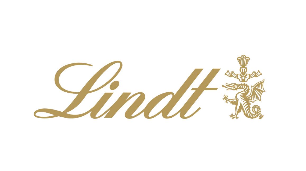 Logotipo dorado de Lindt en elegante caligrafía con un estilizado dragón dorado y cresta sobre fondo blanco.
